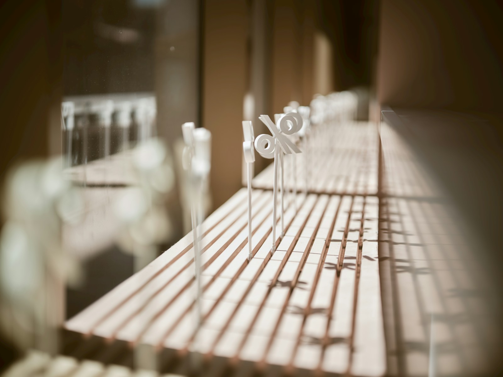 Metal percentage symbols on a wooden shelf